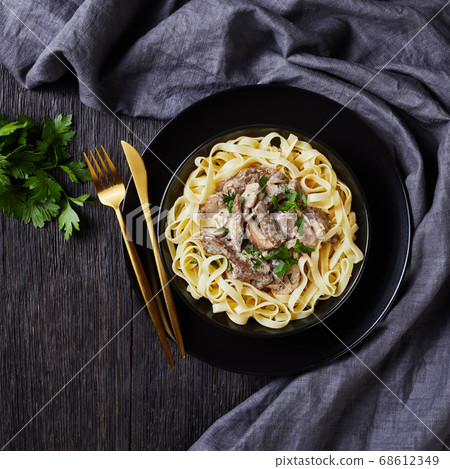 beef stroganoff with egg noodles in a bowl beef stroganoff with egg noodles in a bowl 68612349