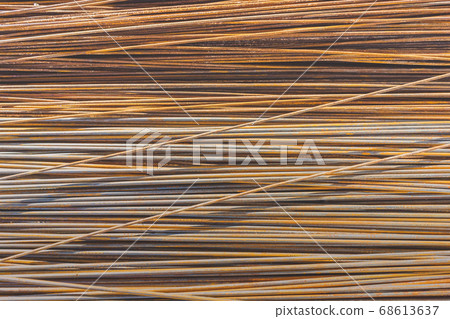 Background texture of old rusty steel bars construction materials in a construction site 68613637