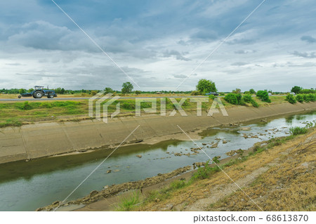 Irrigation canal or irrigation channel in concrete wall Send water from the reservoir to the agricultural area 68613870