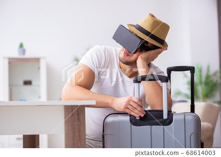 Young man preparing for departure at home Young man preparing for departure at home 68614003