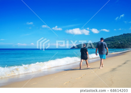 People walking relax on the sand beach in blue sky 68614203