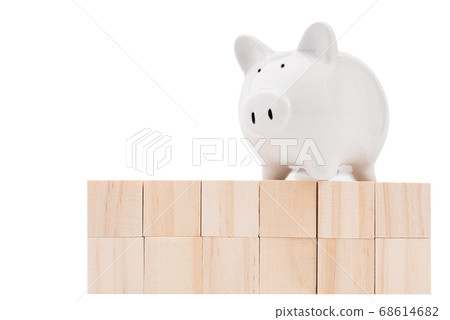 Wood cubes and piggy bank isolated on white Wood cubes and piggy bank isolated on white 68614682