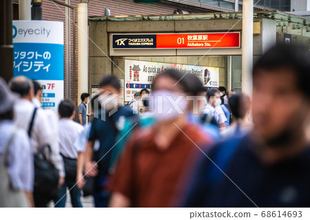 Tokyo cityscape in Japan People walk in front of Akihabara Station in masks in the heat of the summer. Person with chin mask (right) = August 18 Tokyo cityscape in Japan People walk in front of Akihabara Station in masks in the heat of the summer. Person with chin mask (right) = August 18 68614693