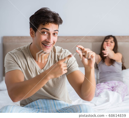 Man suffering from impotency with pill 68614839