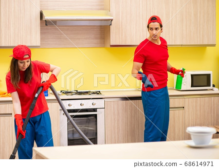 Cleaning professional contractors working at kitchen 68614971