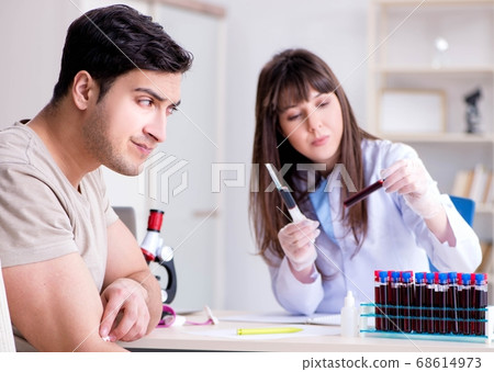 Patient during blood test sampling procedure taken for analysis 68614973
