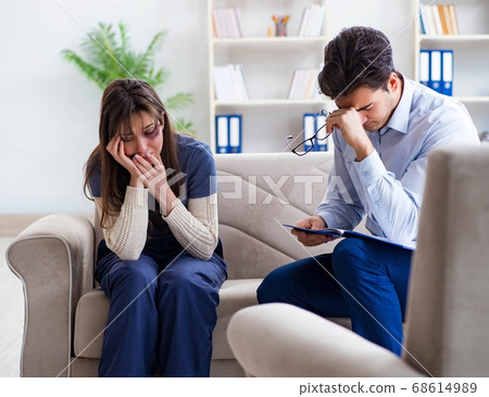 Psychologist counselling woman beaten by husband 68614989