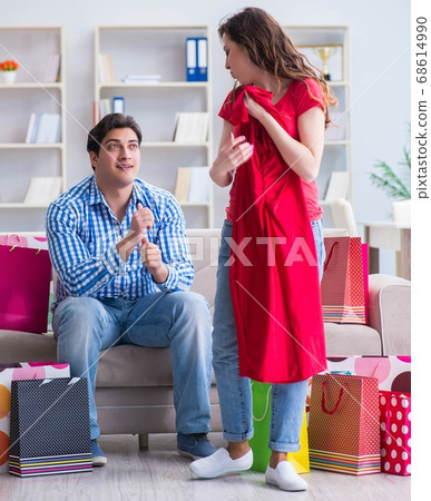 Young pair after shopping with many bags 68614990