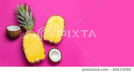 Top view of two halves coconut pineapple on pink background. Flat lay, copy space. Healthy healthy food concept 68615098