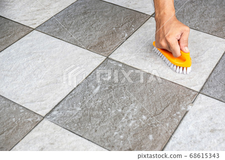 cleaning the tile floor. cleaning the tile floor. 68615343
