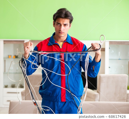 Electrician contractor with tangled cables 68617426