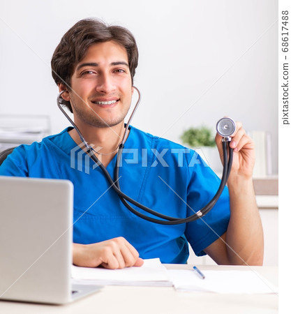 Young doctor working in the hospital 68617488