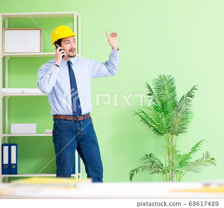 Young male architect working at the project 68617489