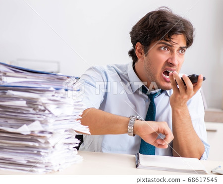 Overloaded busy employee with too much work and paperwork 68617545