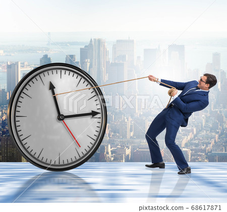 Businessman in time management concept 68617871