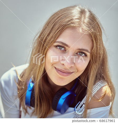 Attractive young white woman walks outdoor. Attractive young white woman walks outdoor. 68617961