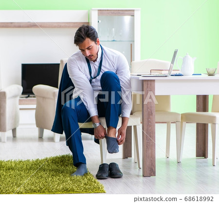 Man dressing up and late for work Man dressing up and late for work 68618992