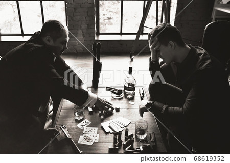 Men play poker, Winning,loser, on desktop arms and Men play poker, Winning,loser, on desktop arms and 68619352