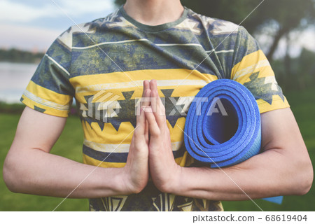Yoga. Close up men hands. Young men do yoga Yoga. Close up men hands. Young men do yoga 68619404