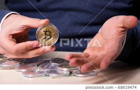 Young man in bitcoin mining concept Young man in bitcoin mining concept 68619474