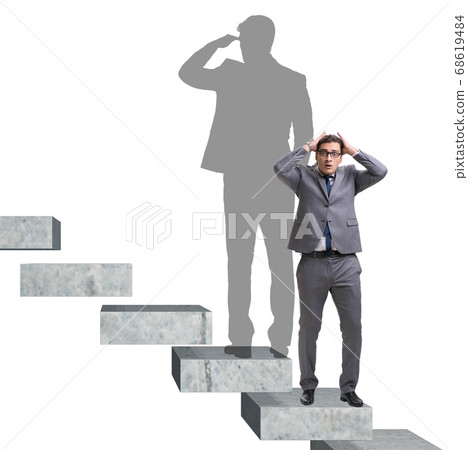 Businessman and his shadow in business concept Businessman and his shadow in business concept 68619484