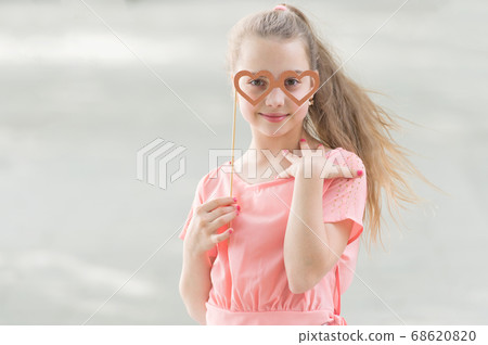Adorable valentines girl. Cute kid holding fancy Adorable valentines girl. Cute kid holding fancy 68620820