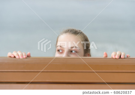 Hide and seek fun. Girl cute smiling kid playful 68620837