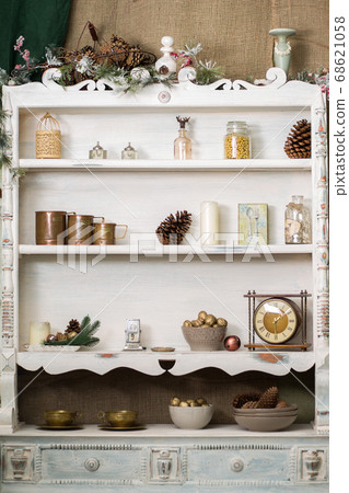 Stylish antique decor with pine cones. White Stylish antique decor with pine cones. White 68621058