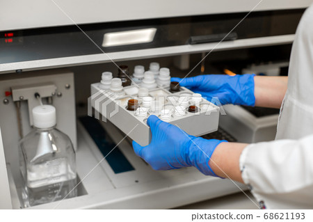 Laboratory technician test blood in automatic Laboratory technician test blood in automatic 68621193