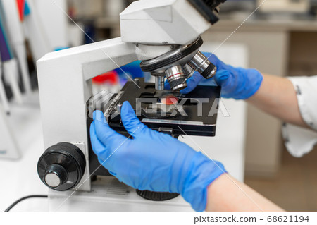 Closeup lab technician research blood sample in Closeup lab technician research blood sample in 68621194