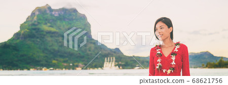 Bora bora French Polynesia Tahiti landscape with mt Otemanu and luxuy cruise ship in background of Asian woman tourist relaxing enjoying honeymoon sunset. Banner panoramic 68621756