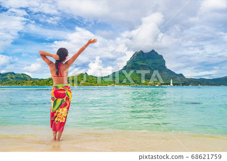Vacation Travel woman walking on Tahiti paradise motu beach Bora Bora Vacation Travel woman walking on Tahiti paradise motu beach Bora Bora 68621759
