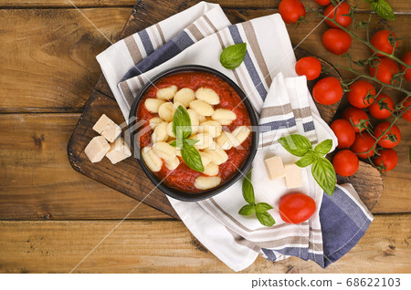 Homemade Italian Gnocchi with Red Sauce, Cheese with basil, olive oil . Close up. Home cooking Homemade Italian Gnocchi with Red Sauce, Cheese with basil, olive oil . Close up. Home cooking 68622103