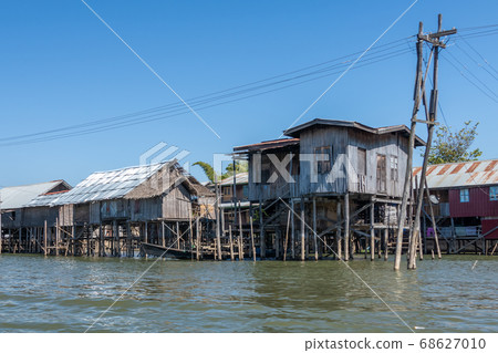 Floating village houses along Inle Lake in Burma 68627010
