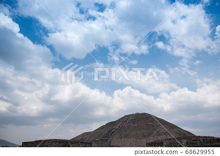 Mexico, World Heritage site of Teotihuacan, people climbing the Pyramid of the Sun 68629955