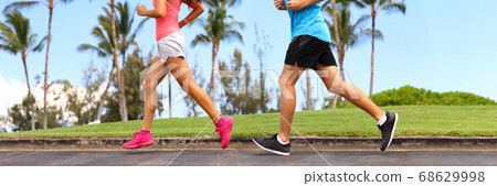Runners legs sprinting outdoors banner- Sportive people racing running in park, closeup of running shoes. Healthy lifestyle and sport concept panorama crop 68629998