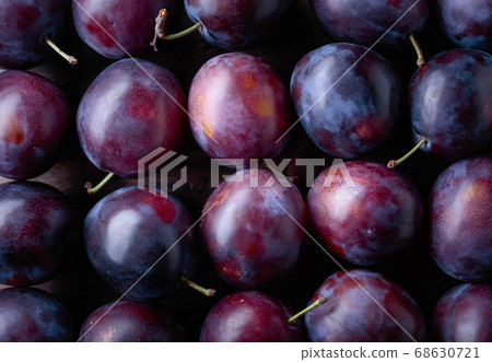 Ripe juicy plums as background. 68630721