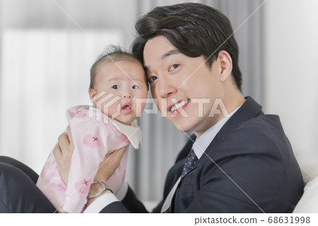 Modern young family concept, young mother and father with newborn 495 Modern young family concept, young mother and father with newborn 495 68631998