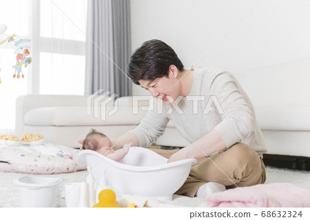 Modern young family concept, young mother and father with newborn 394 Modern young family concept, young mother and father with newborn 394 68632324