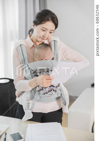 Modern young family concept, young mother and father with newborn 335 68632546