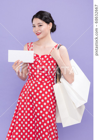 Life style concept, happy shopping time. Young asian woman with shopping bags and cart. 552 68632667