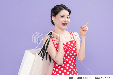 Life style concept, happy shopping time. Young asian woman with shopping bags and cart. 532 Life style concept, happy shopping time. Young asian woman with shopping bags and cart. 532 68632677