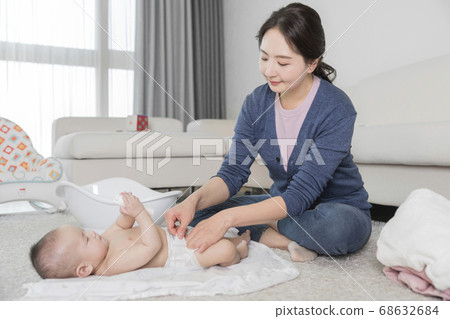 Modern young family concept, young mother and father with newborn 214 68632684