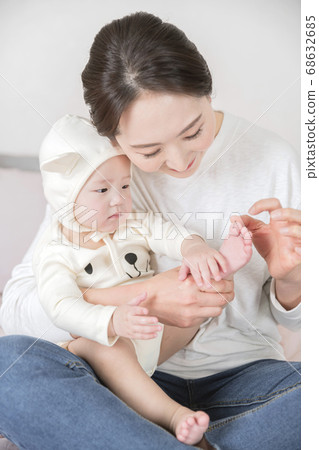 Modern young family concept, young mother and father with newborn 144 68632685
