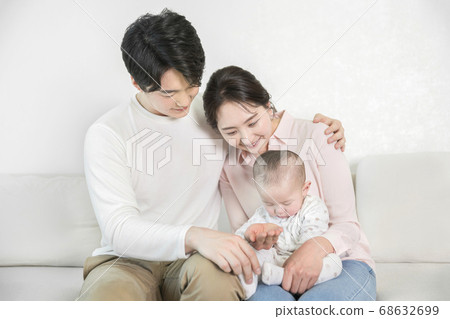 Modern young family concept, young mother and father with newborn 130 68632699
