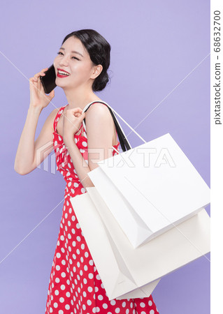 Life style concept, happy shopping time. Young asian woman with shopping bags and cart. 535 Life style concept, happy shopping time. Young asian woman with shopping bags and cart. 535 68632700