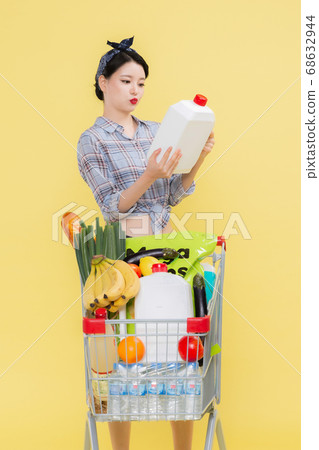 Life style concept, happy shopping time. Young asian woman with shopping bags and cart. 453 68632944