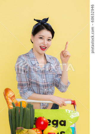 Life style concept, happy shopping time. Young asian woman with shopping bags and cart. 502 Life style concept, happy shopping time. Young asian woman with shopping bags and cart. 502 68632946