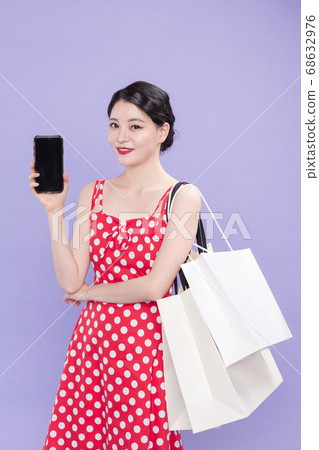 Life style concept, happy shopping time. Young asian woman with shopping bags and cart. 548 68632976