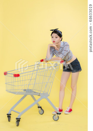Life style concept, happy shopping time. Young asian woman with shopping bags and cart. 434 68633019